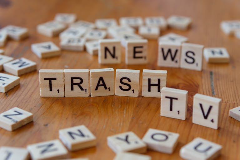 Latest News Updates: A Comprehensive Look at Modern Information, Global Trends, and Digital Journalism 2026 letter tiles spelling out Trash TV News on a table.
