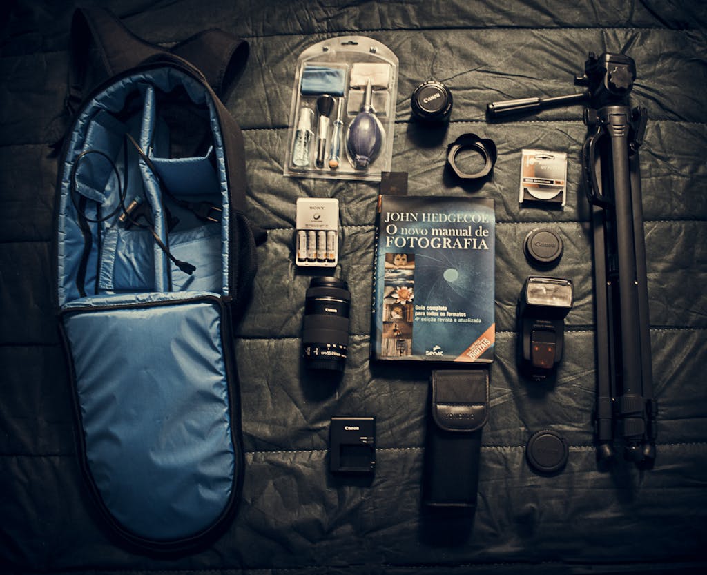 BlazertjeA flat lay of essential camera equipment and accessories for photography.