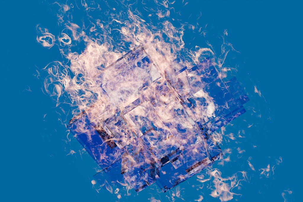 Kinervus A vibrant abstract art piece featuring a fiery geometric design against a blue background.