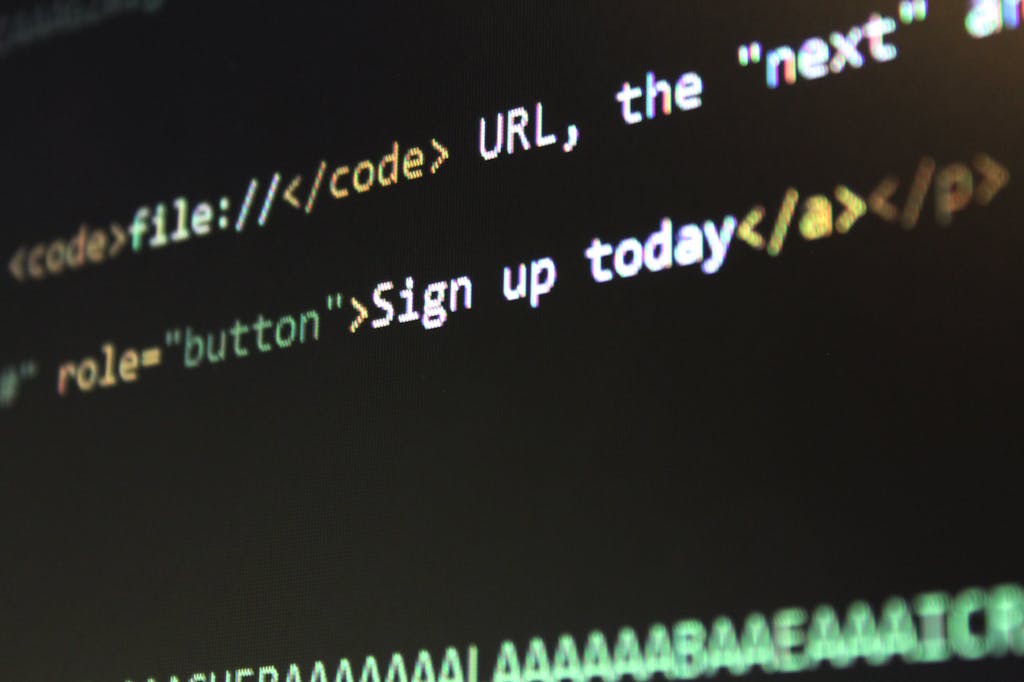 Spaietacle Detailed view of HTML and CSS code on a computer screen, concept of programming.