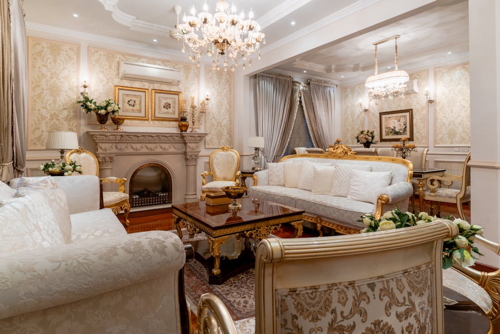 Mozarabic Hoodie Elegant living room with classic Victorian furniture and ornate chandeliers.