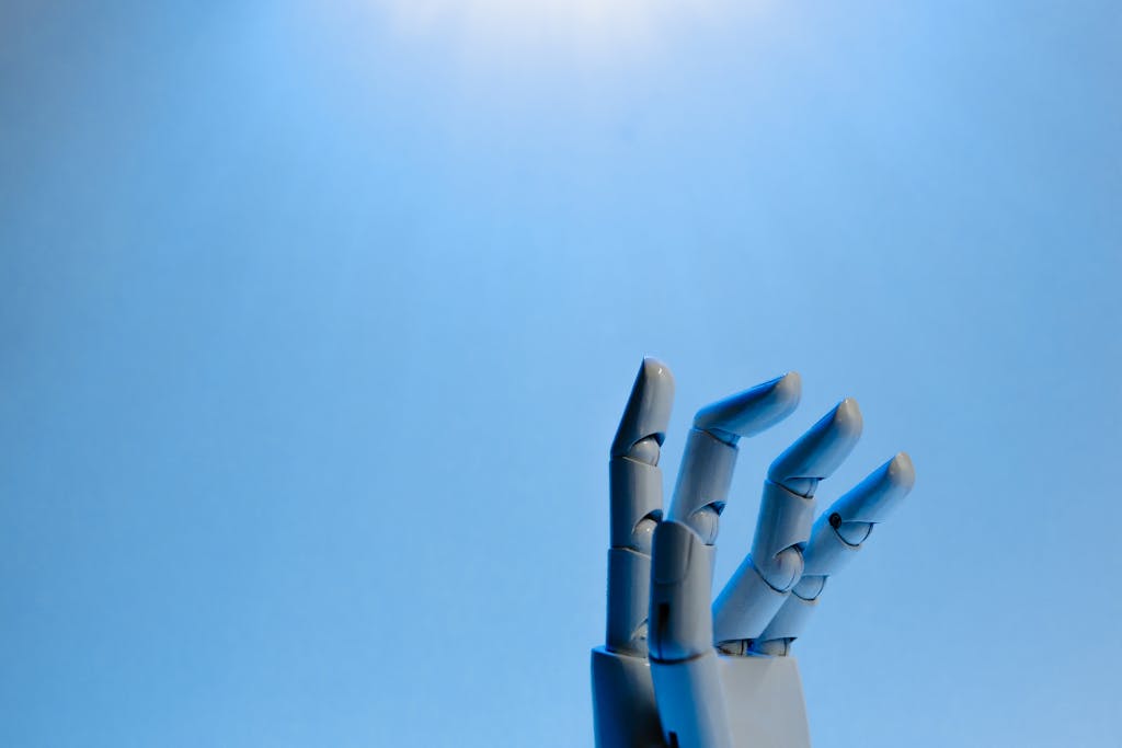 Pxless Robotic hand with articulated fingers reaching towards the sky on a blue background.