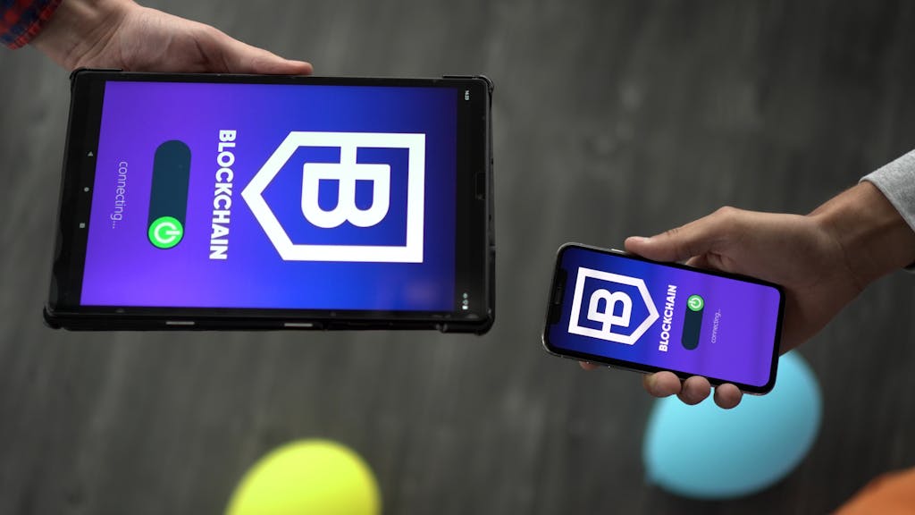 Technology Trends Gonzay Com Smartphone and tablet displaying blockchain app interface, indicating tech connectivity.
