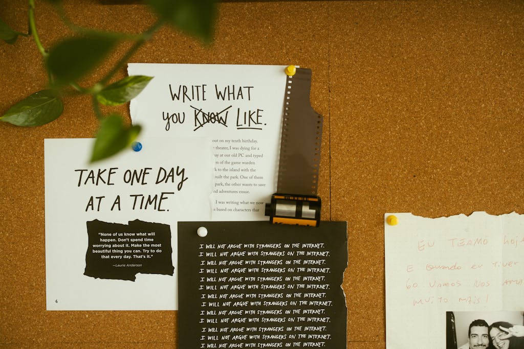 What’s On Tech A corkboard with motivational quotes, notes, and film negatives, fostering creativity and reflection.
