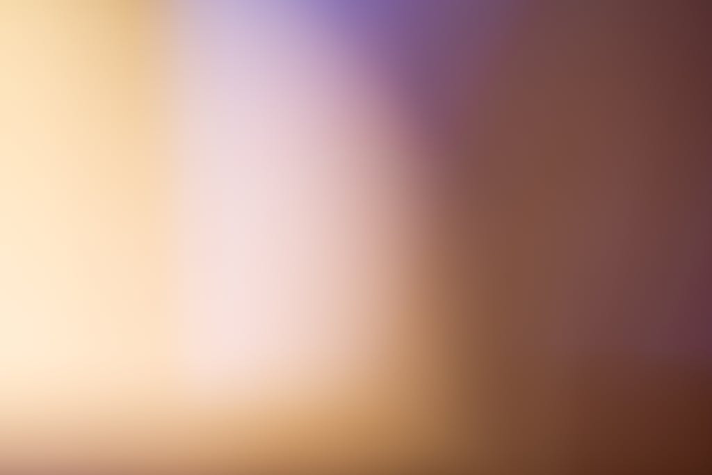 Mansutfer A soothing abstract blurred gradient background with warm tones.