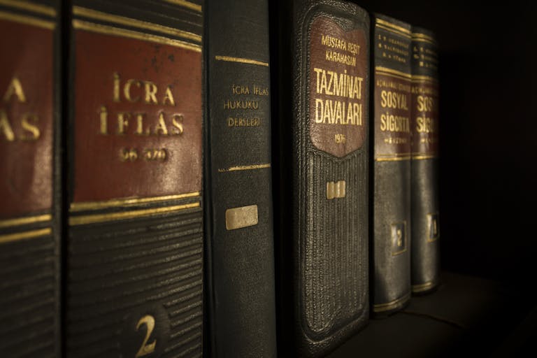 EMFYTEYMATA Detailed close-up of law and regulation books on a bookshelf, emphasizing education and knowledge.