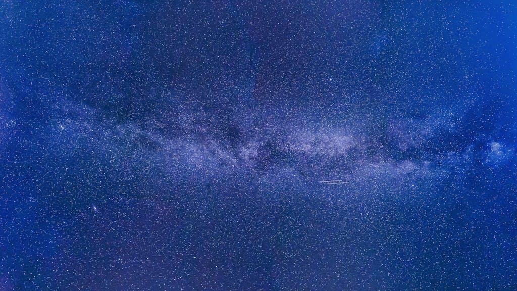 Mansutfer Stunning view of the Milky Way under a starry night sky, showcasing the universe's grandeur.