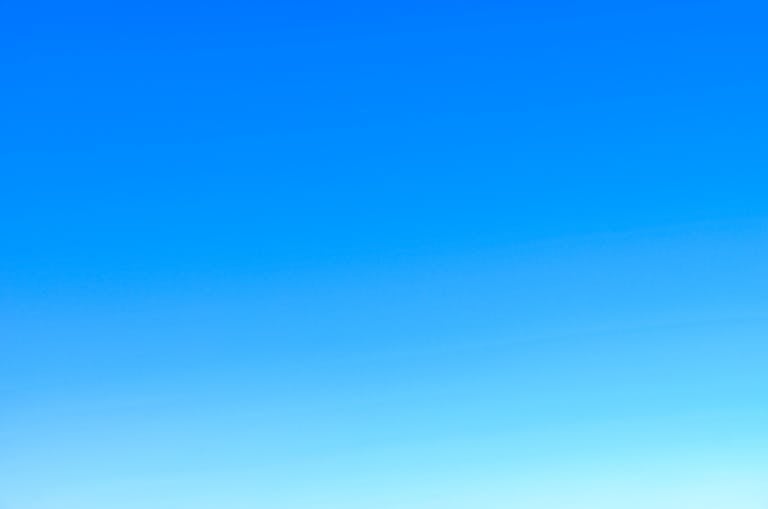 Openskynews serene view of a vibrant clear blue sky with a subtle gradient, perfect for backgrounds.